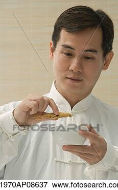 Picture - doctor experimenting 
with traditional 
chinese medicine. 
fotosearch - search 
stock photos, 
pictures, images, 
and photo clipart