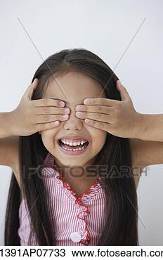 Stock Photo - a young girl covers 
her eyes with 
her hands. fotosearch 
- search stock 
photos, pictures, 
images, and photo 
clipart