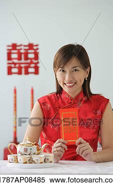 Stock Image - young woman in 
traditional clothing, 
smiling at camera. 
fotosearch - search 
stock photos, 
pictures, images, 
and photo clipart