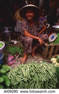 Stock Photography - vietnam,  cai 
be,  mekong delta, 
 woman selling 
vegetables at 
market. fotosearch 
- search stock 
photos, pictures, 
images, and photo 
clipart