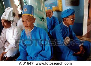 Picture - vietnam, tay ninh, 
cao dai lay priests 
sitting in cao 
dai great temple. 
fotosearch - search 
stock photos, 
pictures, images, 
and photo clipart
