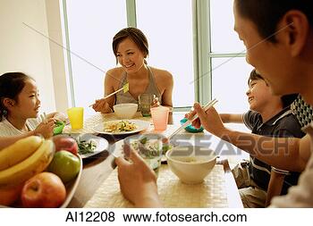 Stock Photo - family having 
a meal together. 
fotosearch - search 
stock photos, 
pictures, images, 
and photo clipart