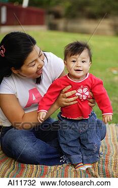 Stock Photo - mother holding 
up baby girl. 
fotosearch - search 
stock photos, 
pictures, images, 
and photo clipart