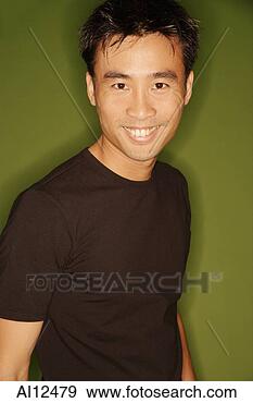 Stock Photograph - young man smiling, 
looking at camera. 
fotosearch - search 
stock photos, 
pictures, images, 
and photo clipart