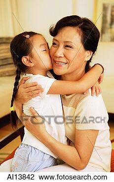 Stock Photo - granddaughter 
kissing grandmother. 
fotosearch - search 
stock photos, 
pictures, images, 
and photo clipart