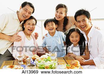 Stock Photograph - multi-generation 
family looking 
at camera. fotosearch 
- search stock 
photos, pictures, 
images, and photo 
clipart