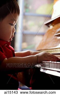 Stock Photo - toddler playing 
on piano. fotosearch 
- search stock 
photos, pictures, 
images, and photo 
clipart