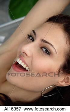 Picture - woman looking 
at camera, smiling. 
fotosearch - search 
stock photos, 
pictures, images, 
and photo clipart