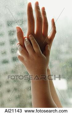 Stock Photo - close-up of mother 
and child's hands 
on window. fotosearch 
- search stock 
photos, pictures, 
images, and photo 
clipart