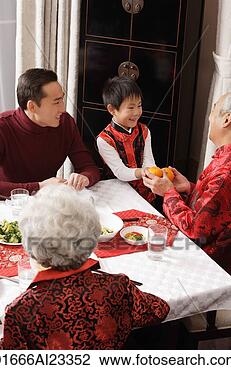 Stock Photo - bot presenting 
grandfather with 
mandarins. fotosearch 
- search stock 
photos, pictures, 
images, and photo 
clipart