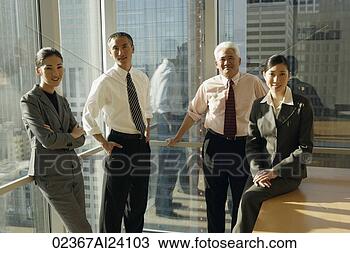 Stock Photo - four colleagues 
in corner office. 
fotosearch - search 
stock photos, 
pictures, images, 
and photo clipart