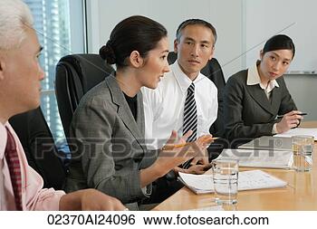 Stock Photo - four colleagues 
at meeting. fotosearch 
- search stock 
photos, pictures, 
images, and photo 
clipart