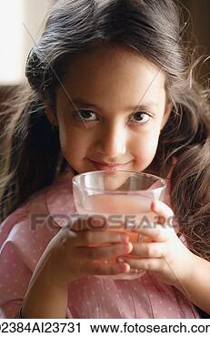 Stock Photography - girl holding pink 
drink, looking 
at camera. fotosearch 
- search stock 
photos, pictures, 
images, and photo 
clipart