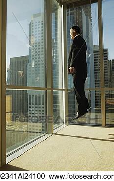 Stock Photography - man jumping in 
corner of office. 
fotosearch - search 
stock photos, 
pictures, images, 
and photo clipart