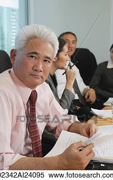 Stock Image - older businessman 
with colleagues 
at meeting. fotosearch 
- search stock 
photos, pictures, 
images, and photo 
clipart
