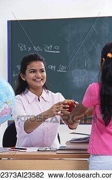 Stock Photo - student handing 
apple to teacher. 
fotosearch - search 
stock photos, 
pictures, images, 
and photo clipart