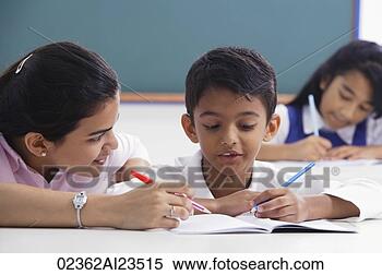 Stock Image - teacher helps 
student with schoolwork. 
fotosearch - search 
stock photos, 
pictures, images, 
and photo clipart