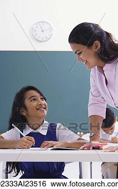 Stock Photo - teacher smiles 
down at student. 
fotosearch - search 
stock photos, 
pictures, images, 
and photo clipart