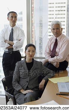 Picture - two businessmen, 
one businesswoman. 
fotosearch - search 
stock photos, 
pictures, images, 
and photo clipart