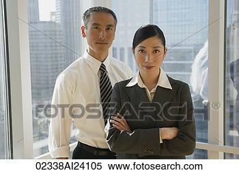 Stock Image - two colleagues 
standing in window. 
fotosearch - search 
stock photos, 
pictures, images, 
and photo clipart