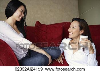 Stock Photograph - two woman chatting, 
one on floor. 
fotosearch - search 
stock photos, 
pictures, images, 
and photo clipart