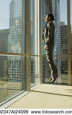 Stock Photograph - woman jumping 
in corner of office. 
fotosearch - search 
stock photos, 
pictures, images, 
and photo clipart