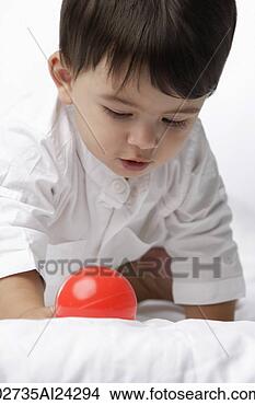 Stock Photo - baby boy with 
red ball. fotosearch 
- search stock 
photos, pictures, 
images, and photo 
clipart