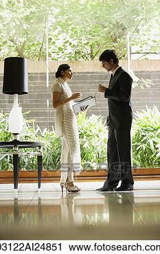 Stock Photography - colleagues in 
hotel lobby. fotosearch 
- search stock 
photos, pictures, 
images, and photo 
clipart