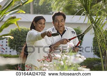 Stock Photo - couple gardening. 
fotosearch - search 
stock photos, 
pictures, images, 
and photo clipart