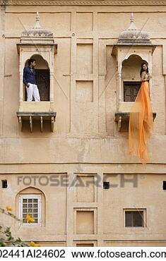 Stock Photo - man and women 
on balconies, 
woman in sari. 
fotosearch - search 
stock photos, 
pictures, images, 
and photo clipart