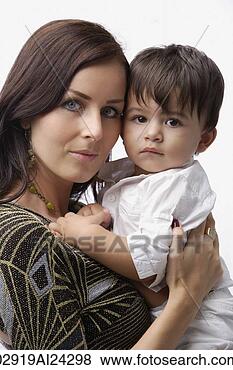 Stock Photo - mother holding 
baby boy. fotosearch 
- search stock 
photos, pictures, 
images, and photo 
clipart