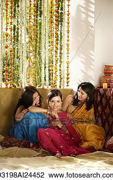 Stock Photo - three young women 
wearing saris. 
fotosearch - search 
stock photos, 
pictures, images, 
and photo clipart