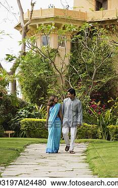 Stock Photography - young couple strolling 
in garden. fotosearch 
- search stock 
photos, pictures, 
images, and photo 
clipart