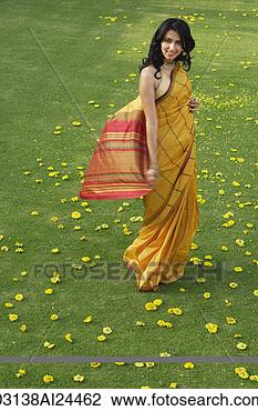 Stock Photo - young woman in 
yellow sari. fotosearch 
- search stock 
photos, pictures, 
images, and photo 
clipart