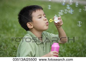 Stock Photography - boy blowing bubbles. 
fotosearch - search 
stock photos, 
pictures, images, 
and photo clipart