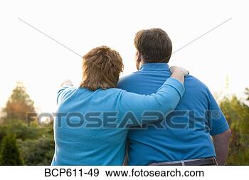 Stock Photograph - backside of couple 
looking at view. 
fotosearch - search 
stock photos, 
pictures, images, 
and photo clipart