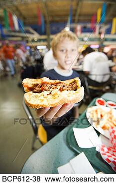 Stock Photo - boy with half 
eaten hamburger. 
fotosearch - search 
stock photos, 
pictures, images, 
and photo clipart