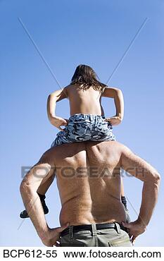 Stock Image - father carrying 
daughter on shoulders. 
fotosearch - search 
stock photos, 
pictures, images, 
and photo clipart