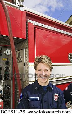 Stock Photo - female firefighter 
with fire truck. 
fotosearch - search 
stock photos, 
pictures, images, 
and photo clipart