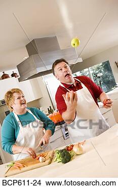 Stock Photo - husband juggling 
fruit with laughing 
wife. fotosearch 
- search stock 
photos, pictures, 
images, and photo 
clipart