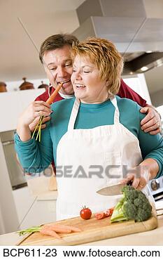 Stock Photo - playful couple 
cooking in kitchen. 
fotosearch - search 
stock photos, 
pictures, images, 
and photo clipart