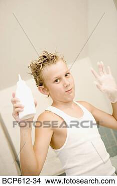 Stock Photo - portrait of boy 
styling hair. 
fotosearch - search 
stock photos, 
pictures, images, 
and photo clipart
