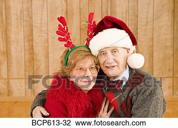 Stock Photo - portrait of elderly 
couple at christmastime. 
fotosearch - search 
stock photos, 
pictures, images, 
and photo clipart