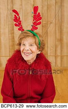 Stock Photograph - portrait of elderly 
woman at christmastime. 
fotosearch - search 
stock photos, 
pictures, images, 
and photo clipart