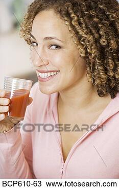 Stock Photo - portrait of woman 
drinking tomato 
juice. fotosearch 
- search stock 
photos, pictures, 
images, and photo 
clipart