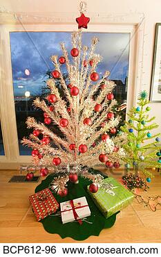 Stock Photo - two fake christmas 
trees in living 
room. fotosearch 
- search stock 
photos, pictures, 
images, and photo 
clipart