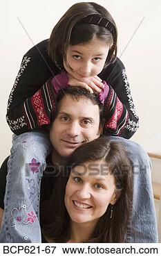 Picture - closeup of couple 
with their daughter. 
fotosearch - search 
stock photos, 
pictures, images, 
and photo clipart