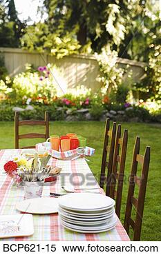 Stock Image - dishes on table 
in garden. fotosearch 
- search stock 
photos, pictures, 
images, and photo 
clipart