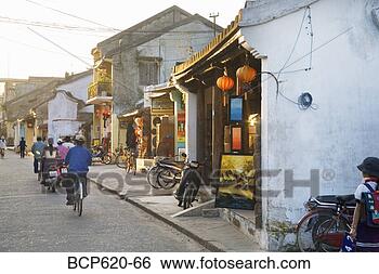 Stock Photo - street with shops 
and people in 
vietnamese town. 
fotosearch - search 
stock photos, 
pictures, images, 
and photo clipart