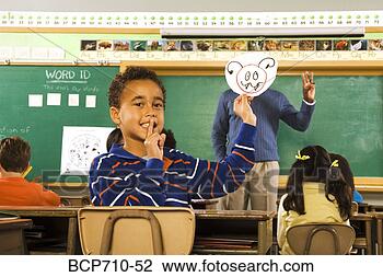 Stock Photo - boy holding drawing 
over teacher’s 
face. fotosearch 
- search stock 
photos, pictures, 
images, and photo 
clipart